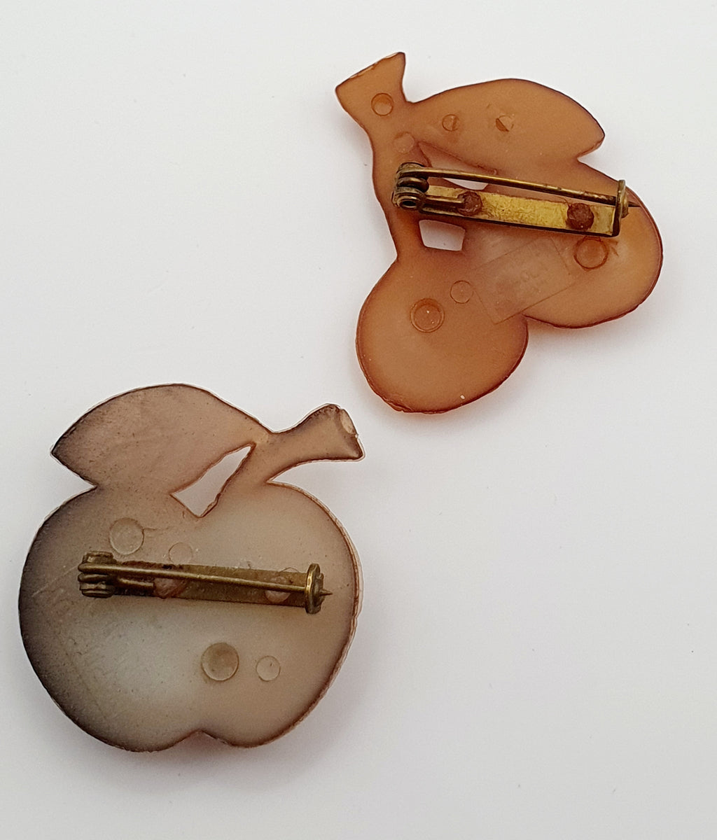 Napite Oy, two brooches, apple and cherries