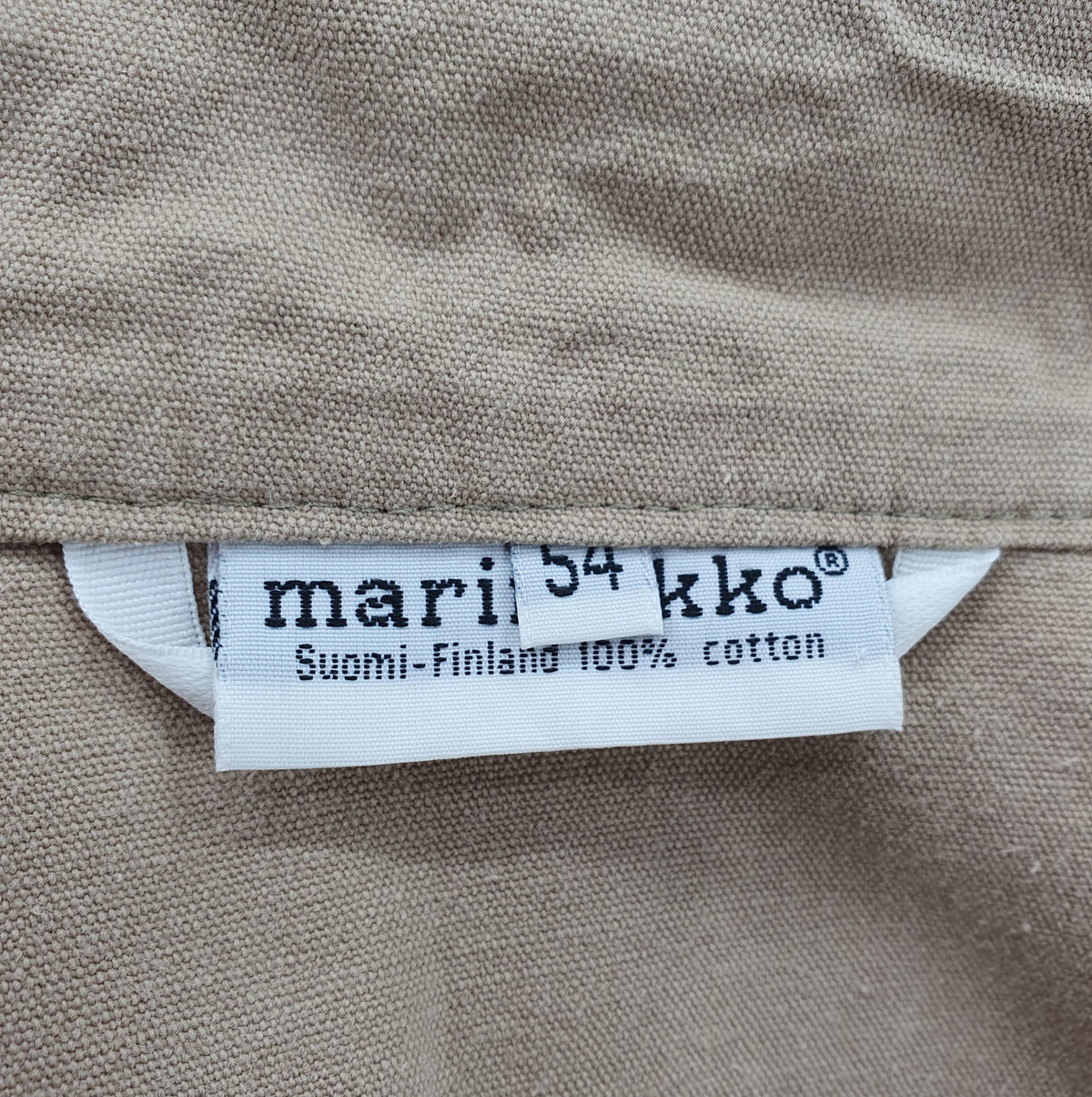 Marimekko MIesten vintage välikausitakki 80-90-luku, väri beige, kuva logosta
